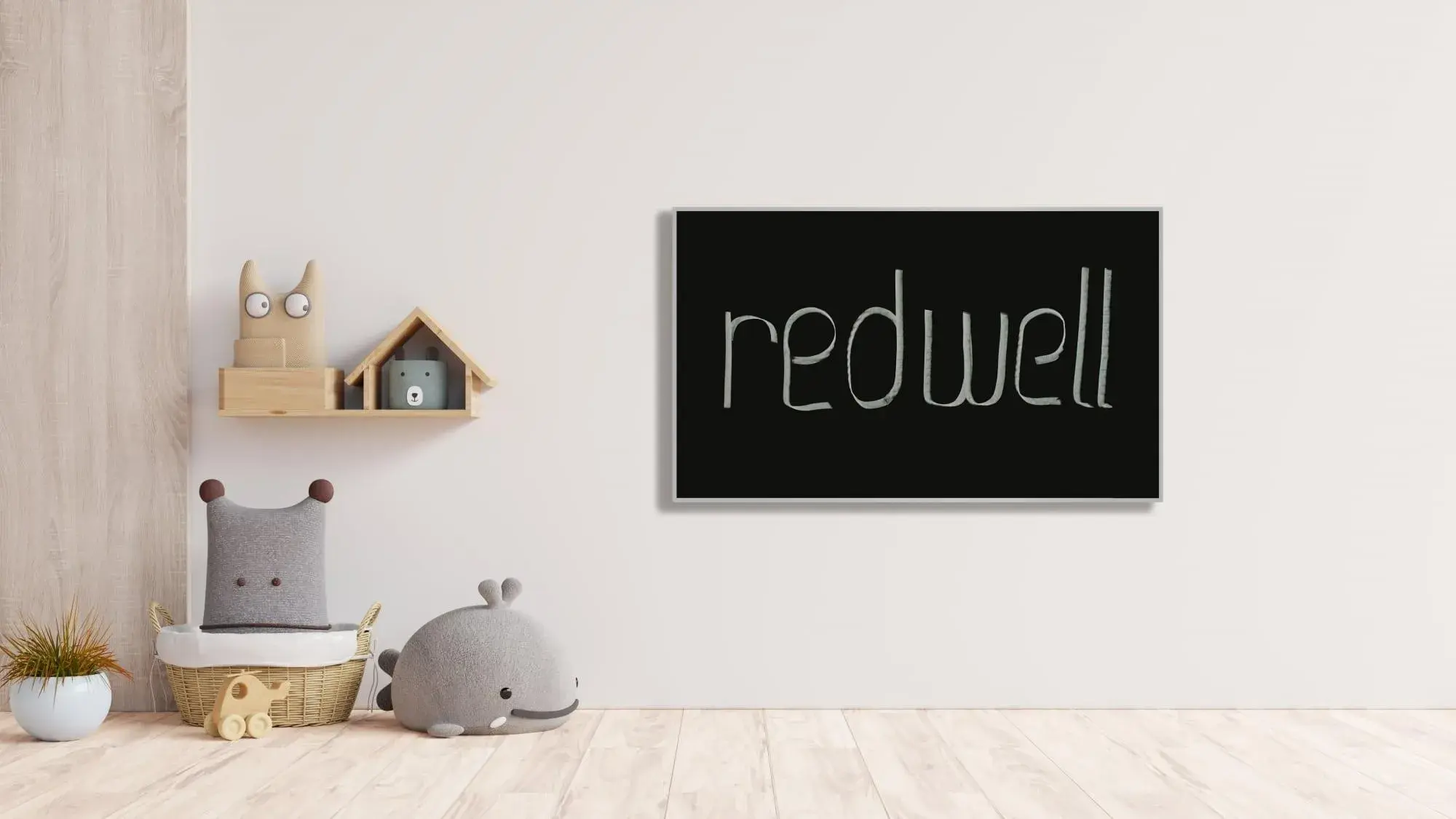 Modernes Kinderzimmer mit Kuscheltieren und einem schwarzen Schild mit der Aufschrift „redwell“.